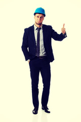 Happy smiling businessman with thumbs up.