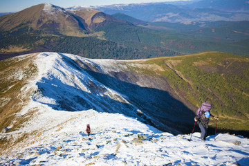 Fototapeta premium The girl is engaged Hiking in the mountains.