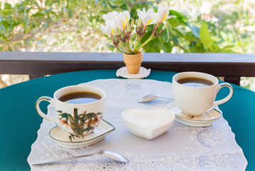 Relaxing time and happiness with two cups of black coffee with sugar