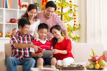 Family with tablet computer