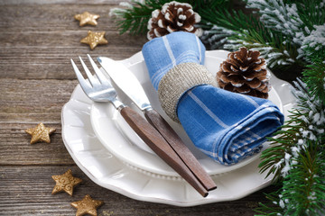 Christmas table setting on a wooden background, close-up