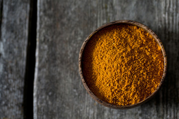 curry powder on wooden surface
