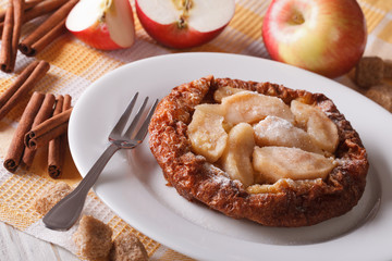 Dutch baby pancake with apples on the table close-up horizontal
