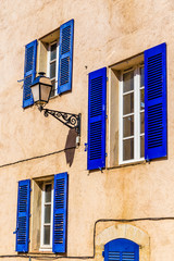 Fototapeta na wymiar Ocher Wall,Lamp And Blue Window-Provemnce,France