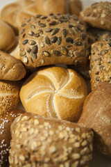 several diverse roll bun with and without seed