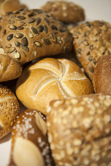 several diverse roll bun with and without seed