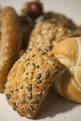 several diverse roll bun with and without seed