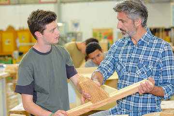 Teacher and students in carpentry class