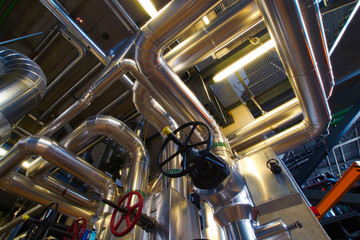 different size and shaped pipes and valves at a power plant