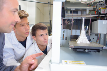 Students watching experiment involving the Eiffel tower