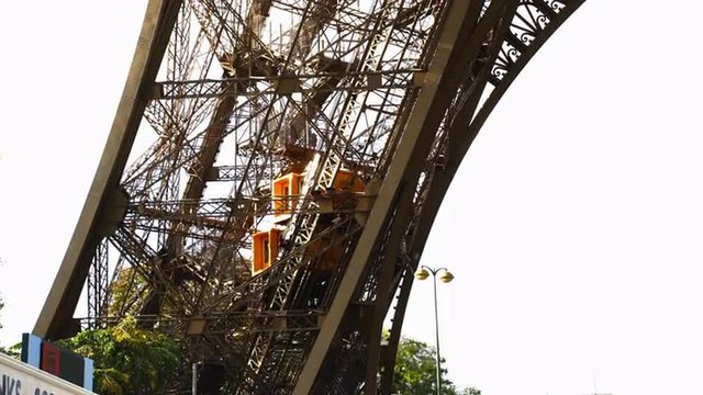 View of elevator carry passenger down the Eiffel Tower