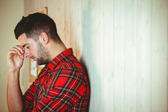 Handsome hipster feeling stressed out