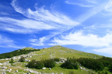 Mountain peak and clouds on sky