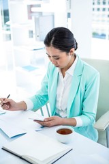 Businesswoman using her smart phone