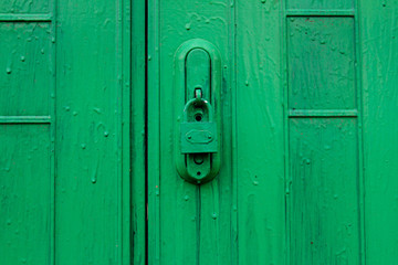 Green door with lock