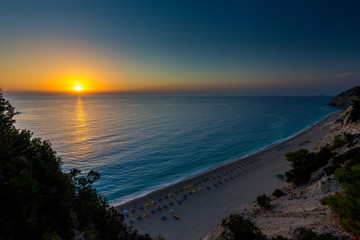 Obraz premium Egremni beach Lefkada at sunset / Beautiful summer white Egremni beach on Ionian Sea (Lefkada, Greece) summer view from nearest rock