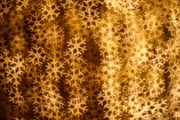 Blurring lights bokeh background of snowflakes