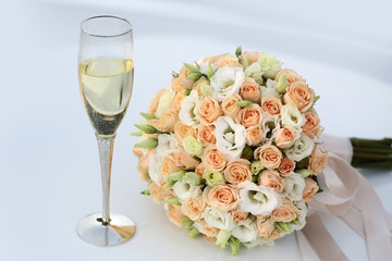 Wedding bouquet and champagne glass
