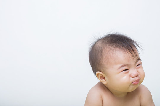 Portrait Of A Fever Baby Crying On Background