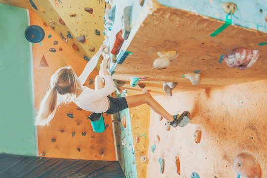 Girl practicing in climbing gym