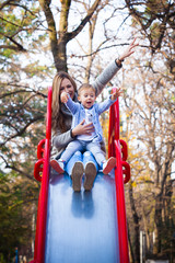 mom and son play in park