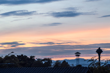 guard tower on sunset sky background