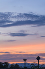 Fototapeta na wymiar guard tower on sunset sky background