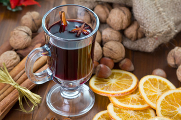 Mulled wine, cinnamon sticks, nuts and dried orange slices