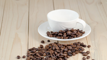 roasted coffee beans with cup