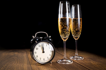 Fototapeta na wymiar New year celebration with flutes of champagne