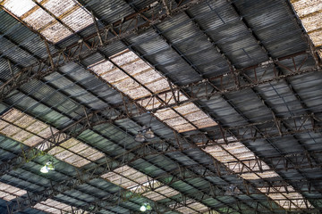 Background of a rusty roof with skylights.