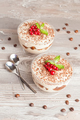 Tiramisu with red currant and chocolate in a glass