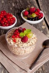 fresh foods for a breakfast on the wooden background, close-up