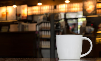 White Coffee Mug On Wooden Table In Cafe With Copyspace