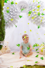 Baby playing in a park near the tents of baldachin © Andriy Petrenko