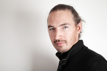 Closeup studio portrait of young man on white