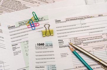 Federal Income Tax form 1040 with pen