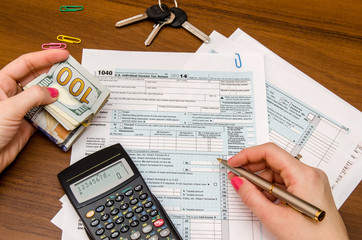 Business Woman Filling the Tax Form 1040