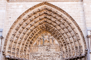 detailed view of the gate to notre dame de paris