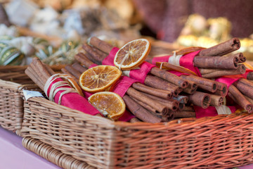 traditional christmas market decoration, basket full of whole cinnamon