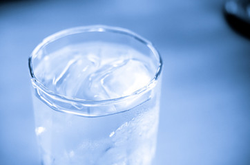 Vintage filter : Close up glass of water on table