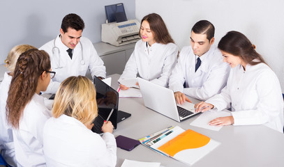 Fototapeta premium Health-care workers and head physician at colloquium in clinic