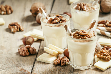 Dessert of white chocolate and walnuts, selective focus