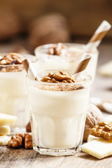 Dessert of white chocolate and walnuts, selective focus