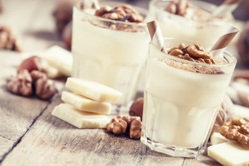 Dessert of white chocolate and walnuts, selective focus