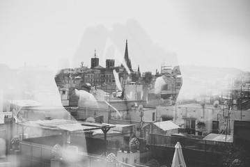 Double exposure with Barcelona and hands