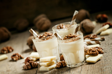 Dessert of white chocolate and walnuts, selective focus