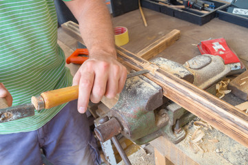 Carpenter working hard in his small 