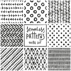 Set of 8 primitive geometric patterns. Tribal seamless backgrounds. Stylish trendy print. Modern abstract wallpaper. Vector illustration.