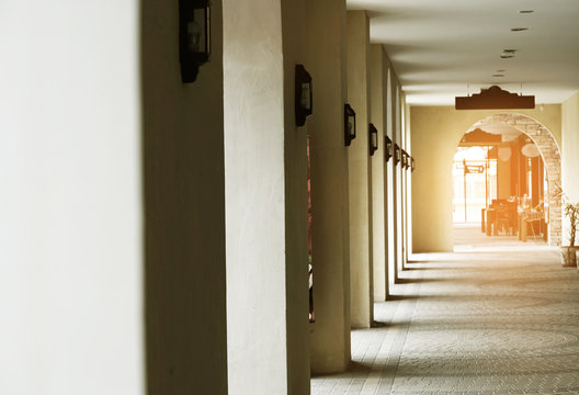 walkway with light from doors